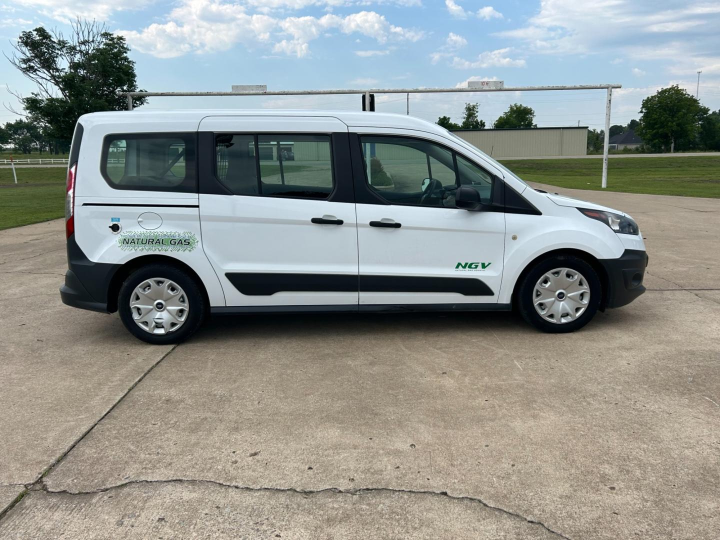 2014 White /Gray Ford Transit Connect Wagon XL w/Rear Liftgate LWB (NM0GE9E75E1) with an 2.5L L4 DOHC 16V engine, 6-Speed Automatic transmission, located at 17760 Hwy 62, Morris, OK, 74445, (918) 733-4887, 35.609104, -95.877060 - 2014 FORD TRANSIT CONNECT HAS 2.5L ENGINE, FEATURES POWER LOCKS, POWER WINDOWS, POWER MIRRORS, AM/FM STEREO, CRUISE CONTROL, BLUETOOTH HANDS-FREE CALLING, BACKSEAT,IT RUNS ON CNG (COMPRESSED NATURAL GAS) OR GASOLINE. A PREMIER ALTERNATIVE FUEL CONVERSION THAT IS EPA-APPROVED. EXTREMELY CLEAN-BURNING - Photo#3